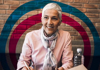 Elderly female employee conducting job interview